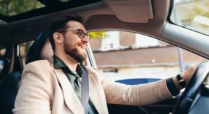 Man sitting inside car driving