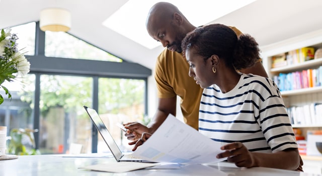 Young couple working with paper documents